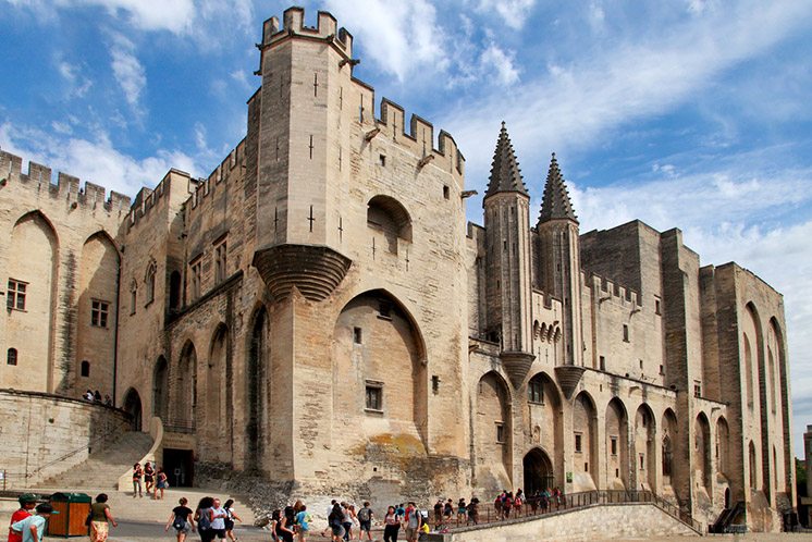 AVIGNON, FRANCE - 1 JULY 2014: Pope palace in Avignon which became the residence of the Popes in 1309. Palace occupies an area of 2.6 acres. July 1, 2014 Avignon.