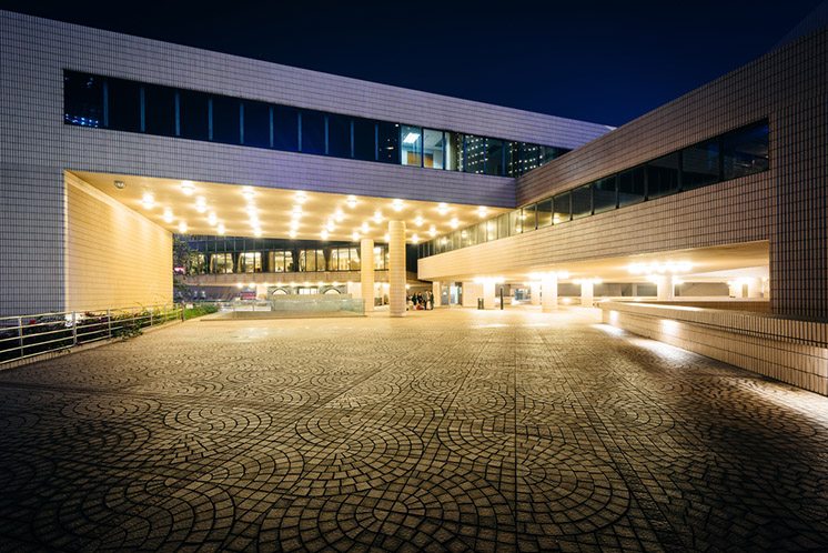 The exterior of the Hong Kong Cultural Centre at night, in Kowlo