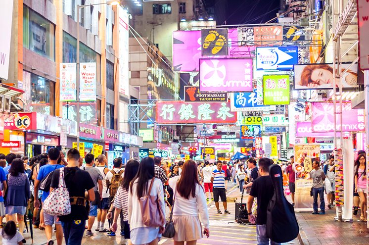 Many people in Mongkok street at night.