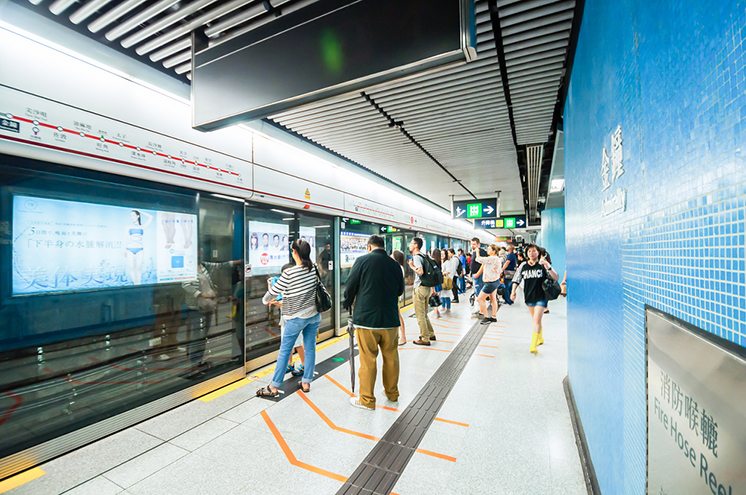 People waiting MTR train at Causeway Bay station.