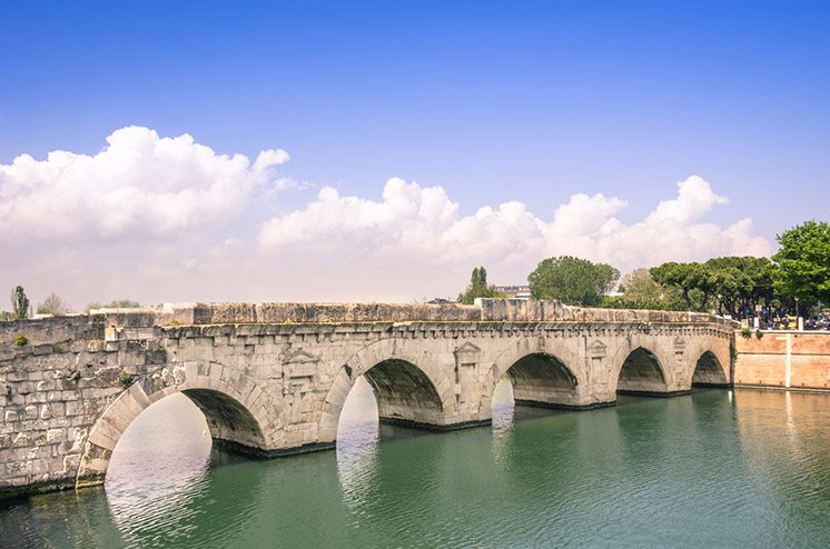 Roman Tiberius Bridge on Marecchia river in Rimini Italy