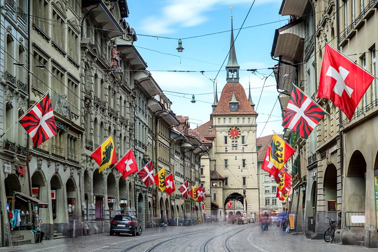 Shopping alley with the famous clocktower of Bern on Switzerland