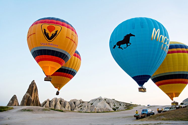 GOREME/ TURKEY - MAY 25, 2015: Hot air balloons take off in Capp